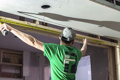 Commercial drywall contractors working on the ceiling by Pronto Drywall